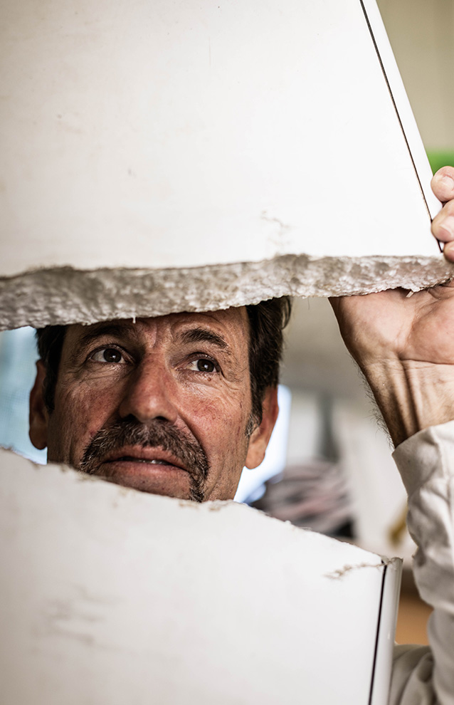 a person holding up a piece of paper