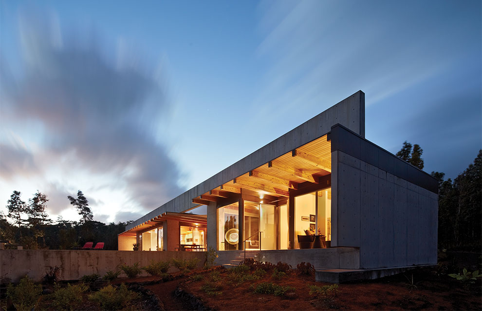 a house with a concrete wall and a concrete wall