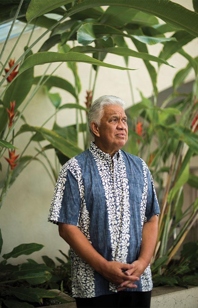 a person standing in front of plants
