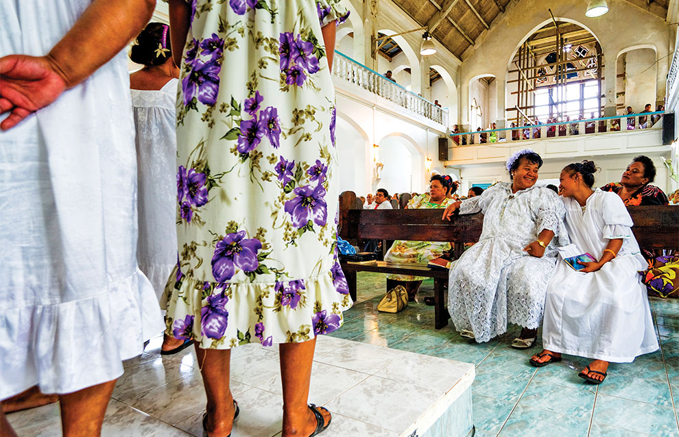 a group of women in white dresses
