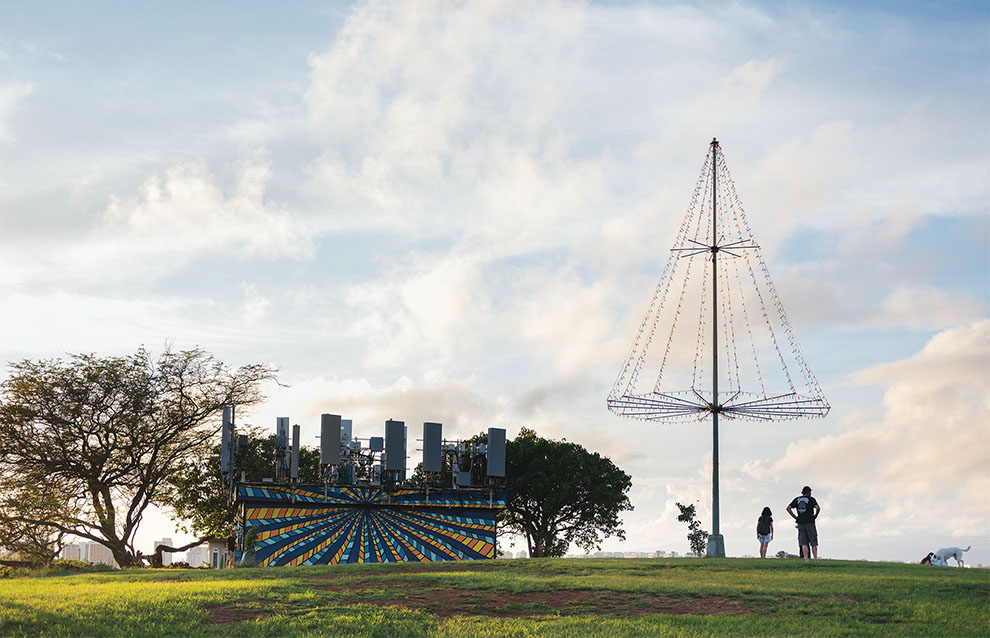 park setting with silhouette of people on a sunny day with clouds