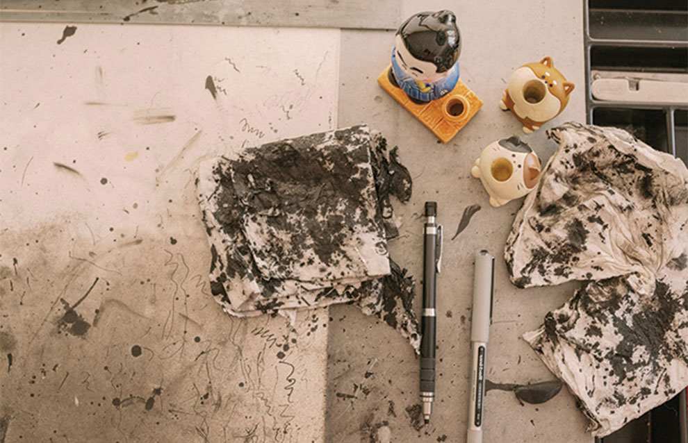 artist's canvas and ink stains on used paper and towels from a hard day's work.