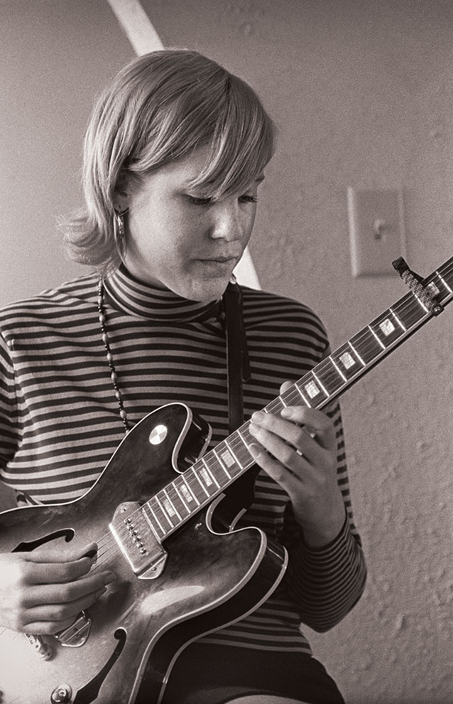 a person playing a guitar