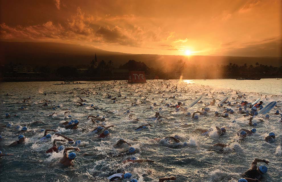 a group of people swimming in water