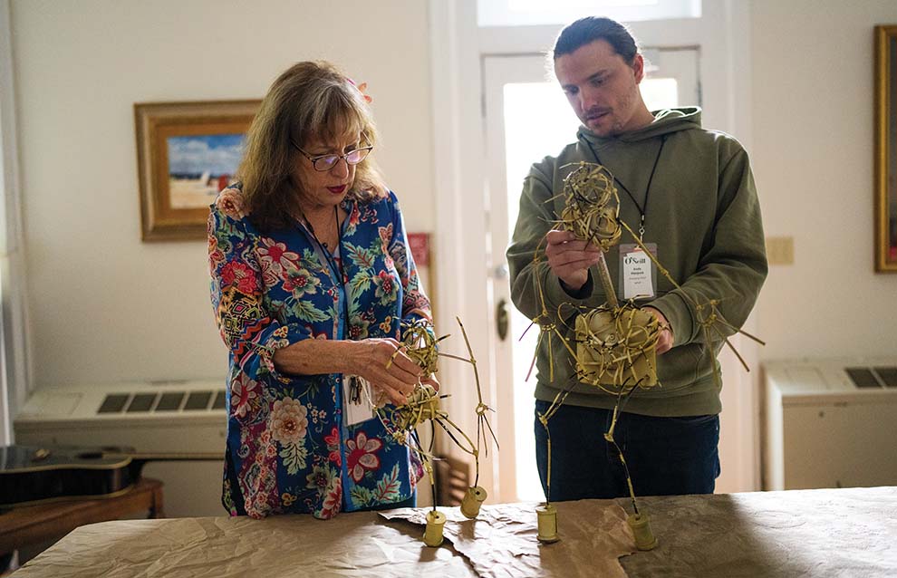 a person and person holding sticks
