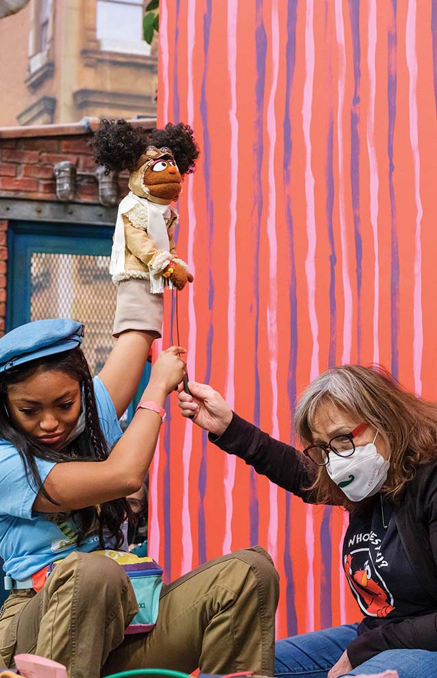 a person holding a puppet