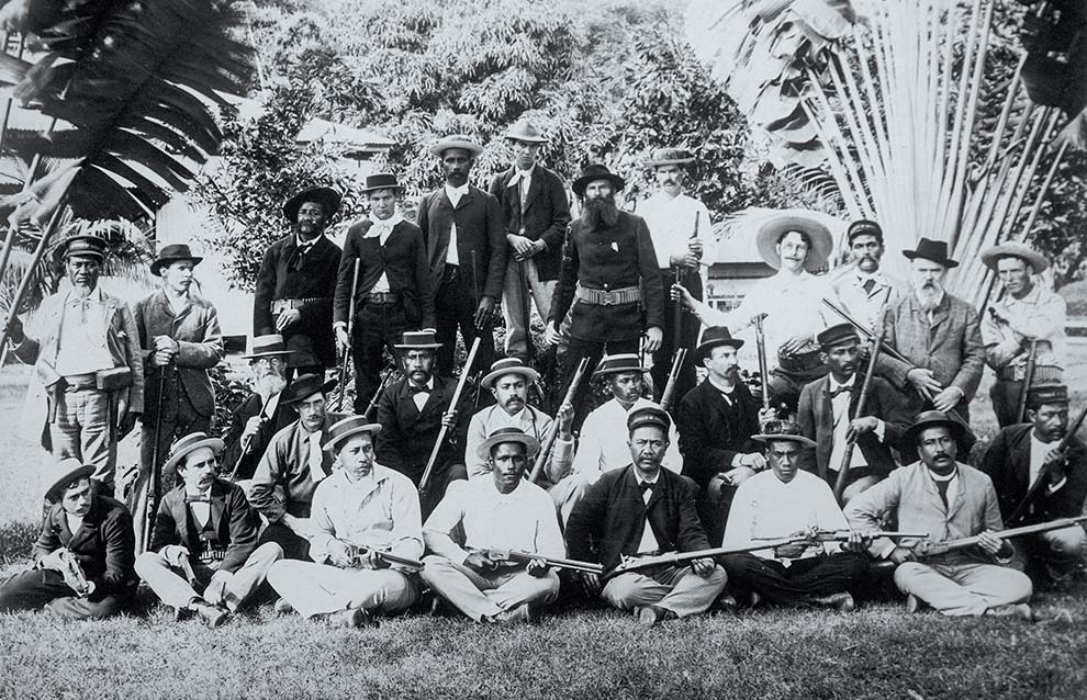 a group of men in cowchild hats posing for a photo