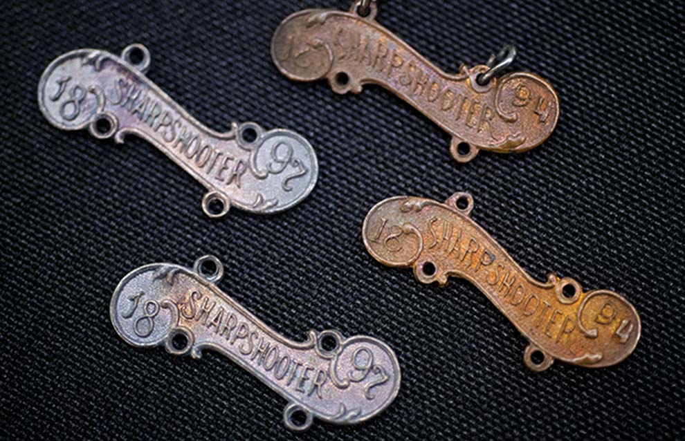 a group of metal tags with writing on them