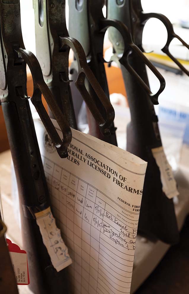 a close-up of several rifles