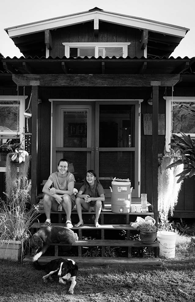 a person and child sitting on a porch